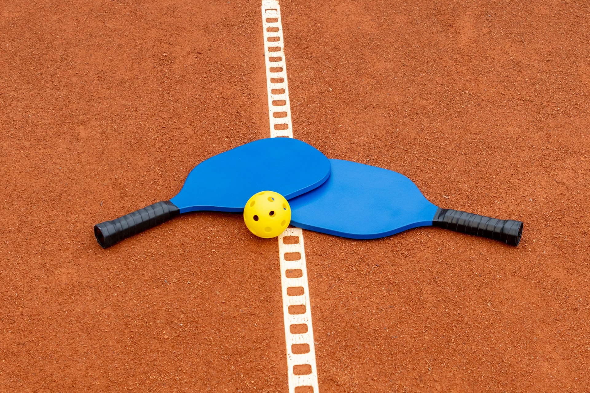 a tennis racket with a smiley face on it