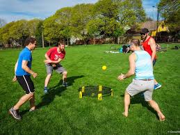 Some boys are playing spike ball game